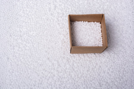 A high angle shot of a box with white polystyrene foam ballsの写真素材