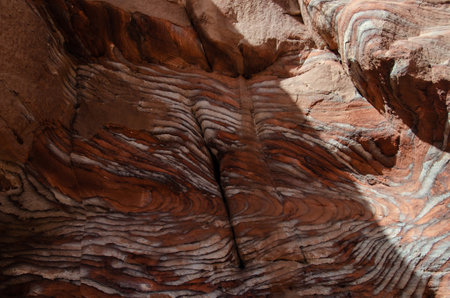 Brightly colored rock formation in the desert city of Petra, Jordan.の写真素材