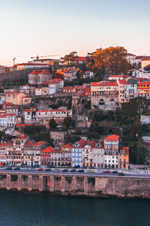 A vertical shot of the old and colorful buildings of Oporto in Portugal captured during the daytimeの写真素材