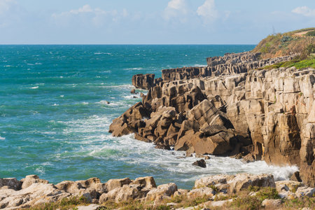 Peniche sea cliffs with atlantic ocean in Portugalの写真素材
