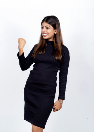 A happy Indian businesswoman celebrating successの写真素材