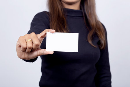 A woman hand showing a blank cardの写真素材