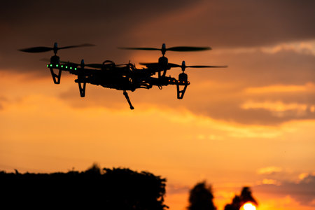 A closeup shot of a flying drone at beautiful sunse