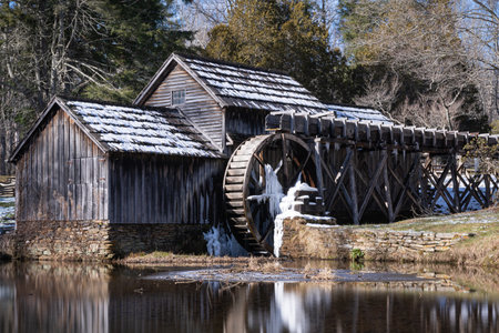 The Mabry Mill covered in snow and ice during the winter.の写真素材