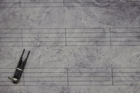 Sheet music rustic background with miniature bagpipesの写真素材