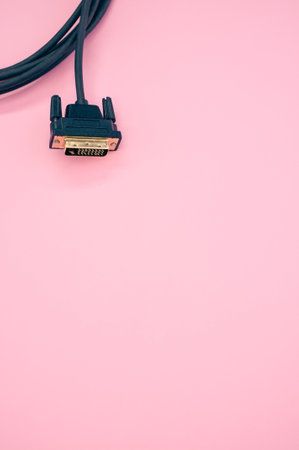 A closeup shot of DVI cable isolated on a pink backgroundの写真素材