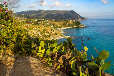 Panoramic view from Capo Vaticano over Grotticelle beach at sunset, Italyの写真素材