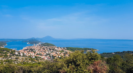 Seaside town on island of Losinj, Croatia. View, landscape, coast, coastline, shore, land, ocean, city, architecture, nature, outdoor.の写真素材