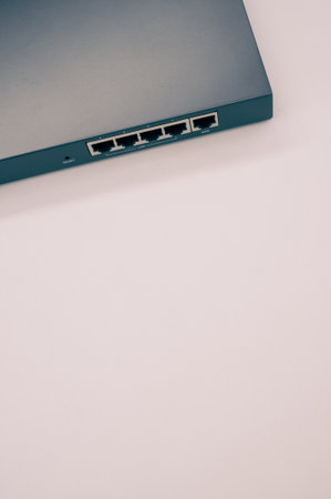 A vertical shot of the USB ports on an electronic on a beige surface