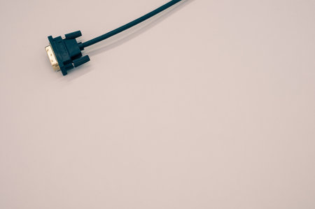 A high angle closeup shot of a cable on a beige surface