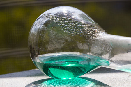 A closeup shot of a glass container with chemical liquidの写真素材