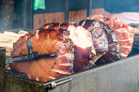A selective focus of roasted pork on a grillの写真素材
