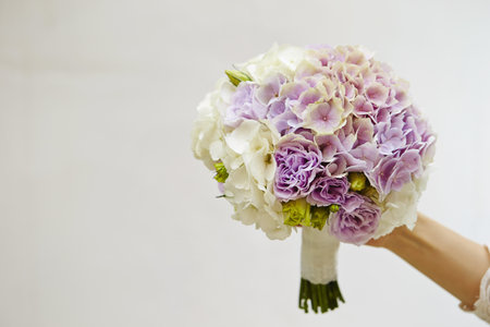 A purple bouquet of beautiful purple flowers specially made for the brideの写真素材