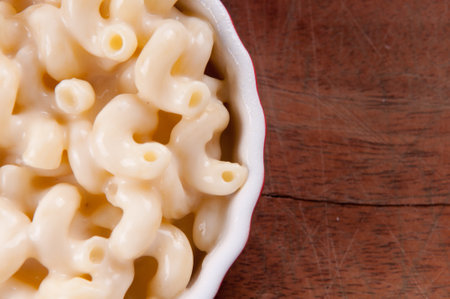 macaroni noodles and cheese with toasted breadcrumb toppingの写真素材