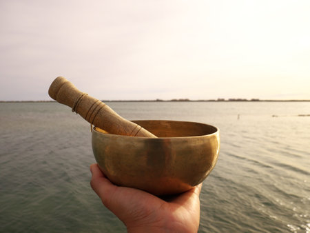 Metal singing bowl for relaxing and receiving healing vibrationsの写真素材