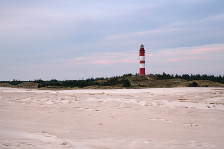 A beautiful view of the Wittduen lighthouse at sunset, Amrum, Germanyの写真素材