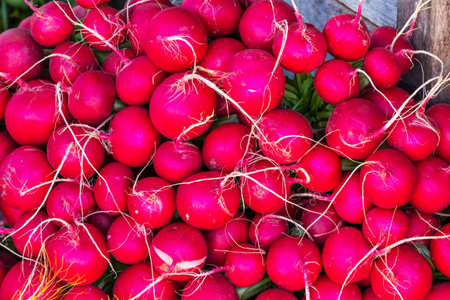 A top view of a heap of radish in a market