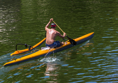 A person sailing on a canoe kayak in the lakeの写真素材