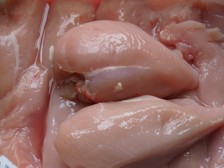 A closeup shot of raw chicken breast meatの写真素材