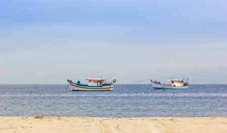 Two fishing boats sailing in the sea at dayti