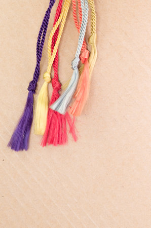 A vertical shot of colorful braid threads