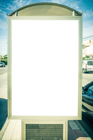 A vertical shot of a billboard at a bus stationの写真素材