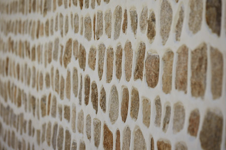 A blurry shot of a natural brown stone wall background