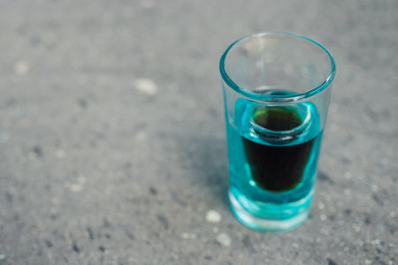 A closeup shot of blue curacao liqueur on a blurred backgroundの写真素材
