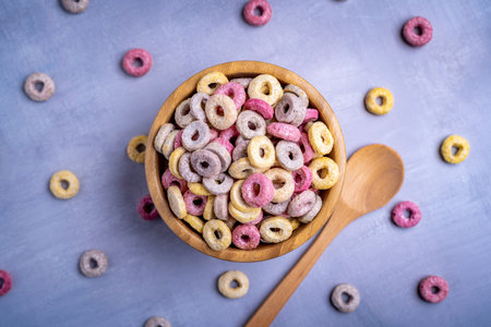 A closeup shot of colorful round cereals on the bowlの写真素材