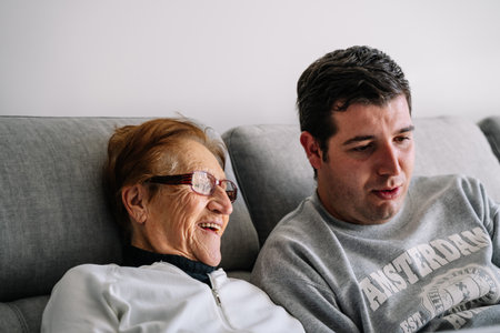 An older happy grandmother spending leisure time with her grandsonの写真素材