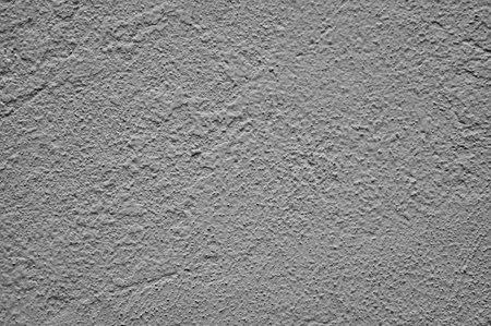A closeup of a textured and white painted wall