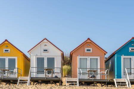 Several colored beach houses in the Netherlandsの写真素材