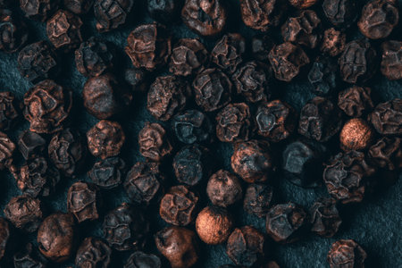 A top view of smoked black peppercornsの写真素材