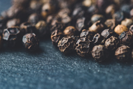 A closeup of black peppercornsの写真素材