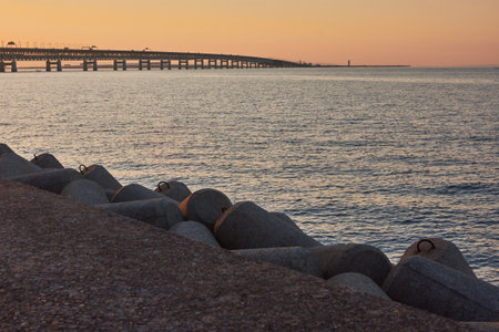 A lot of tetrapods on the beach at sunsetの写真素材