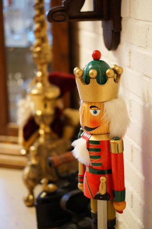 A vertical selective focus shot of nutcracker wooden figure