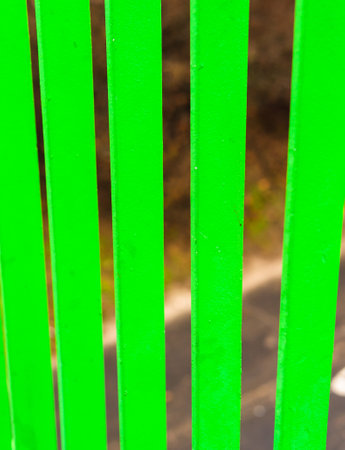 Close up of a metal green barrierの写真素材