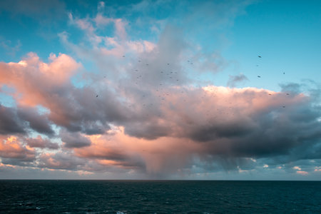 A landscape of the sea under a blue cloudy sky in the evening - great for wallpaperの写真素材