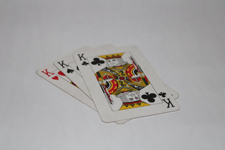 A closeup shot of playing cards isolated on a white background