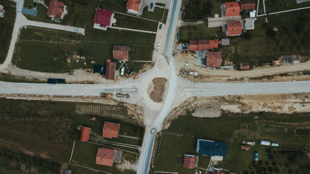 A top view of a road under construction in Brcko district surrounded by villages, Bosnia and...