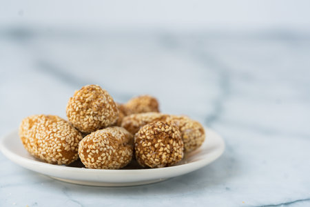 A selective focus shot of sesame balls in a plate