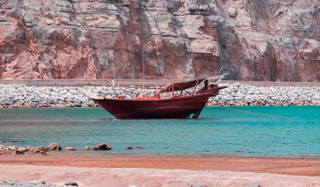 A wide-angle lens shot of a boat near the shore in Khasab, Omanの写真素材