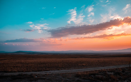 A mesmerizing view of the sunset over the countrysideの写真素材