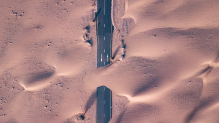 A highway covered by sand after a sandstorm in a desert in UAE