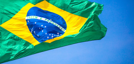 A closeup shot of the waving flag of Braziの写真素材
