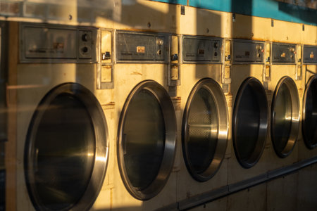 A laundry with many old washing machinesの写真素材