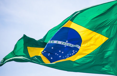 A closeup shot of a brazil flag waving on the windの写真素材