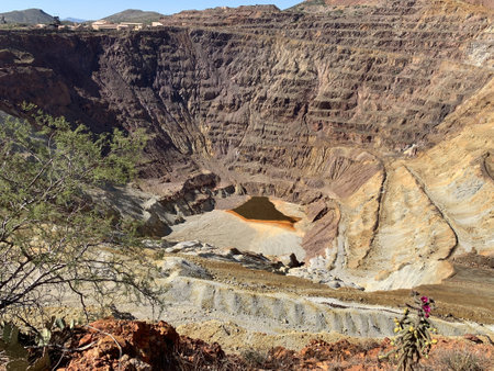 The rock layers at a huge copper mine near Bisbee, Arizonaの写真素材