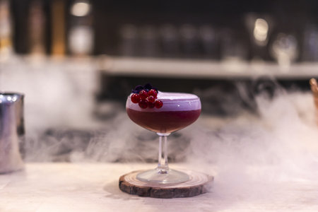 A selective focus shot of a smoke cocktail at the night clubの写真素材