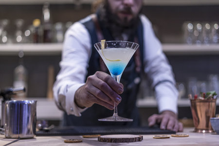 A bartender making an exotic cocktail at the night club